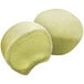 Two green My/Mochi ice cream balls.