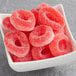A bowl filled with red Kervan Gummy Watermelon Rings.
