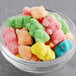 A glass bowl filled with colorful Kervan Neon Gummy Bears.