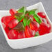 A bowl of Kervan Gummy Cherries on a counter.