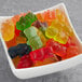 A bowl of Kervan 12-color gummy bears on a table.