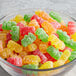 A glass bowl of colorful Kervan Sour Gummy Bears.