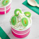 A cup of ice cream with Kervan Gummy Apple Rings on top.