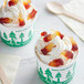 Two cups of ice cream with Kervan Gummy Cola Bottles on top.