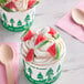 A cup of ice cream with Kervan Gummy Watermelon Slices on top.