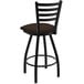 A black Holland Bar Stool ladderback swivel bar stool with a brown cushion.