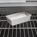 A loaf of bread in a Chicago Metallic aluminized steel bread loaf pan.