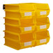A stack of yellow Triton LocBin containers with white labels on the front.