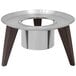 A Spring USA Wynwood stainless steel and faux wood round display stand with a circular center.