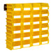 Yellow Triton LocBins on a wall with white rails.