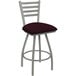 A Holland Bar Stool Jackie Ladderback Swivel Bar Stool with a maroon cushion and gray frame.