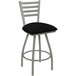 A Holland Bar Stool Jackie Ladderback Swivel Bar Stool with black vinyl seat.