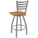 A Holland Bar Stool Jackie ladderback swivel bar stool with a wooden seat and metal back.