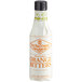 A white bottle of Fee Brothers Orange Bitters with an orange logo.