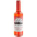 A bottle of Fee Brothers Maraschino Cherry Syrup on a counter.