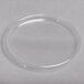 A clear plastic lid on a white surface.