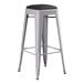 A Lancaster Table & Seating gray metal backless bar stool with black cushion.