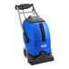 A blue Clarke carpet extractor with wheels.