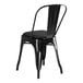 A black Lancaster Table & Seating metal cafe chair with a black cushion.