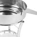 A stainless steel Thunder Group butter melter pan with a lid and a spoon.