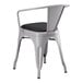 A Lancaster Table & Seating gray metal chair with black cushion.