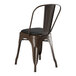 A brown Lancaster Table & Seating Alloy Series copper chair with black cushion.