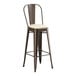 A brown metal Lancaster Table & Seating bar stool with a white cushion.
