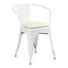 A Lancaster Table & Seating white metal arm chair with a white cushion.