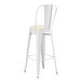 A Lancaster Table & Seating white bar stool with a white cushion.