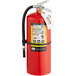 A Badger Advantage fire extinguisher with white label and wall bracket.