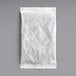 A white paper bag with Davidson's Organic Moroccan Mint Iced Tea Filter Packs on a gray surface.