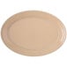 A beige Carlisle Dallas Ware oval platter.