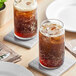 Two glasses of Pepsi Zero Sugar soda with ice on a table