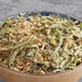 A bowl of Davidson's Organic Lemon Medley herbal loose leaf tea.
