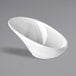 A white APS Minis melamine bowl with a curved edge on a gray surface.