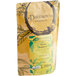 A yellow bag of Davidson's Organic Spiced Raspberry Loose Leaf Tea with a label.