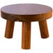 An APS Element wooden three-legged stool.