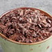 A white bowl filled with Davidson's Organic Cacao Bliss tea leaves.