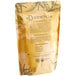 A brown bag of Davidson's Organic Decaf Green Loose Leaf Tea with text and leaves.