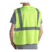 A person wearing a lime green Cordova high visibility safety vest.