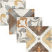 A close-up of a tan tile with brown and white designs.