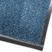 A blue carpet mat with a black border.