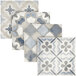 A display of blue and white Abert Domino tiles with different patterns.