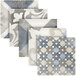 An Abert Domino blue tile display with four different designs.