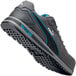 A gray and blue Puma athletic shoe with a composite toe.