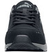 A black Puma Airtwist Low women's athletic shoe with a grey sole on a table.