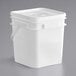 A white plastic tub of Cookie Dough Bliss Edible Red Velvet Cookie Dough with a lid and a handle.