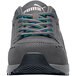 A Puma women's gray and blue water-resistant athletic shoe with non-slip soles.
