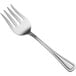 An Oneida New Rim stainless steel serving fork with a silver handle.