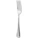 A close-up of a Oneida Inn Classic stainless steel dinner fork with a silver handle.
